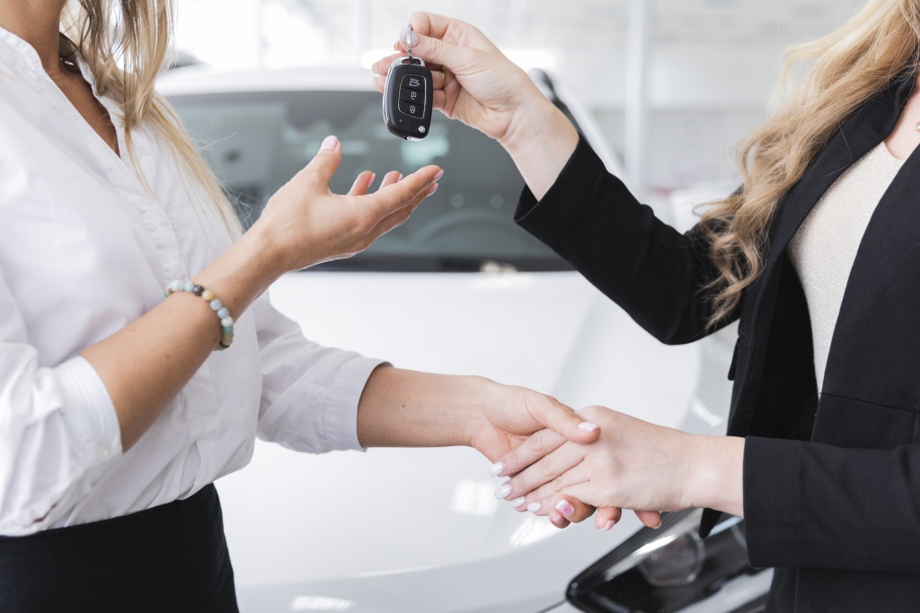 side-view-woman-receiving-car-keys.jpg